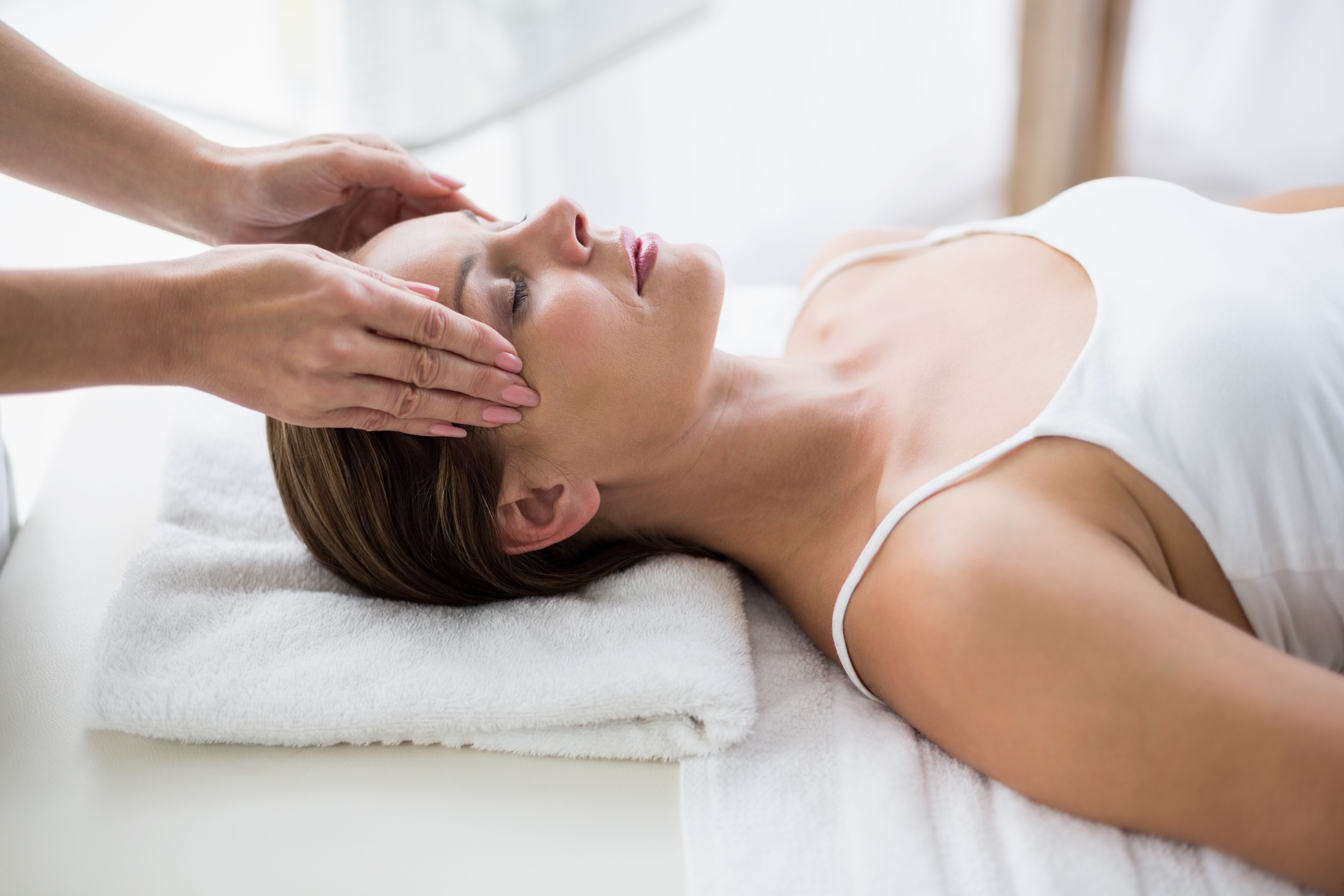 A woman having a head massage